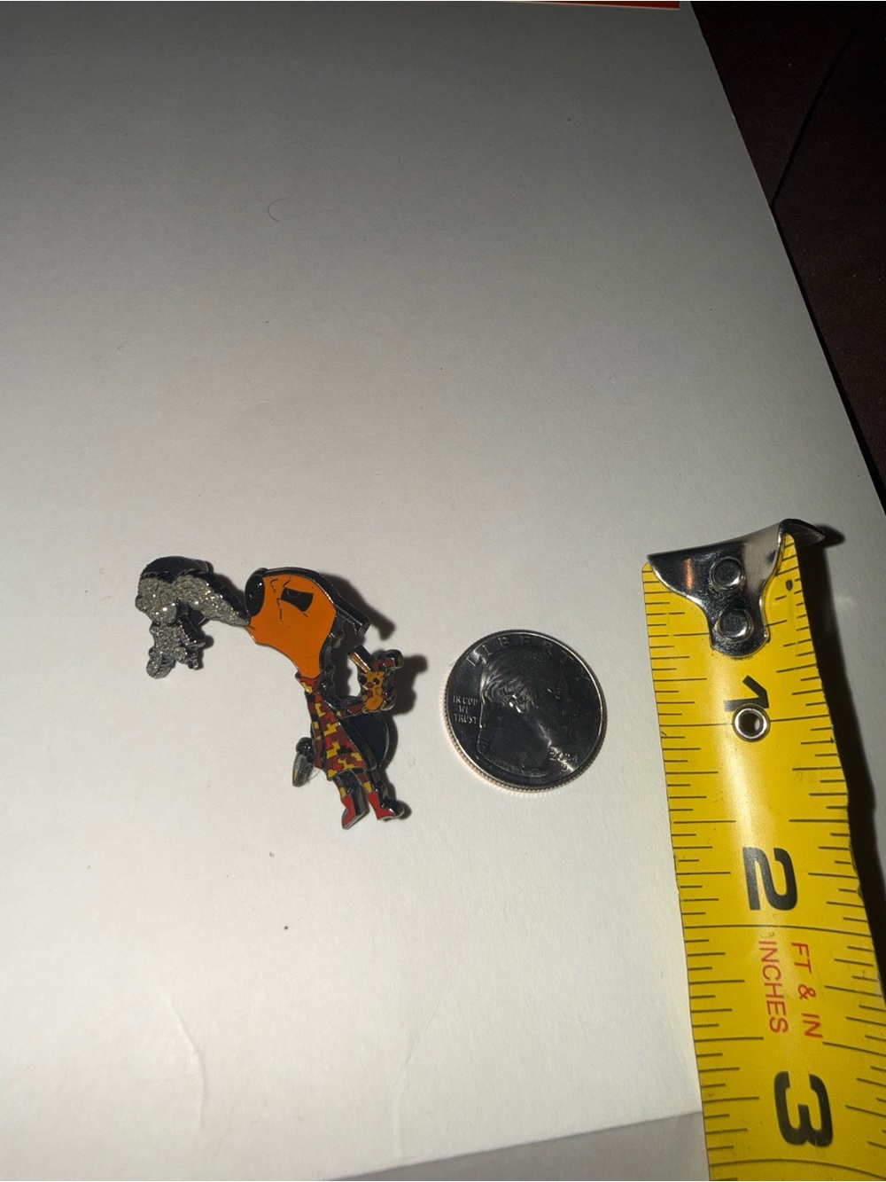 Woodstock pin with orange dog and black bird